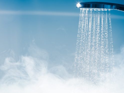Hot water spraying from a shower faucet 
