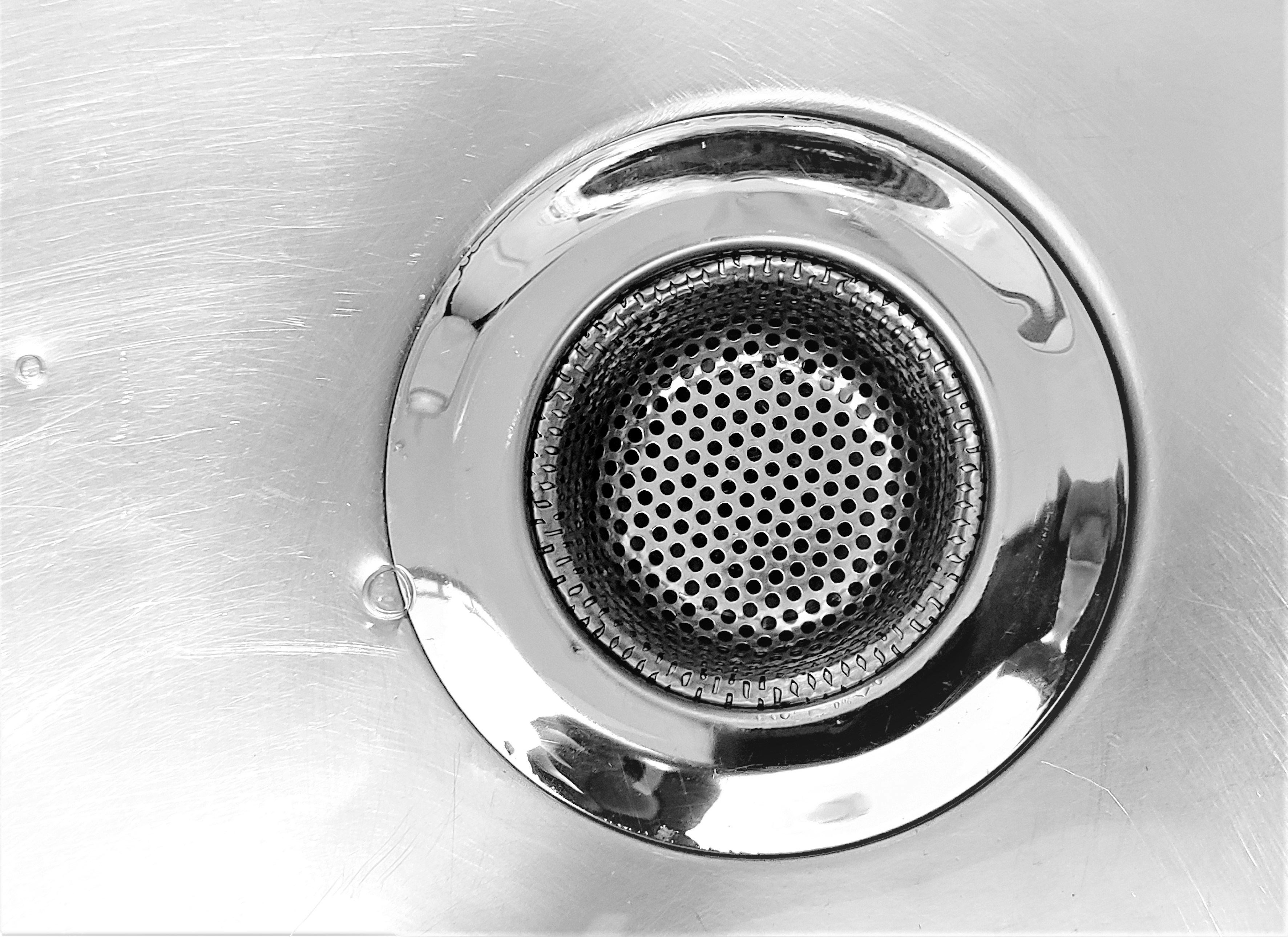 Close-up of a stainless steel sink drain