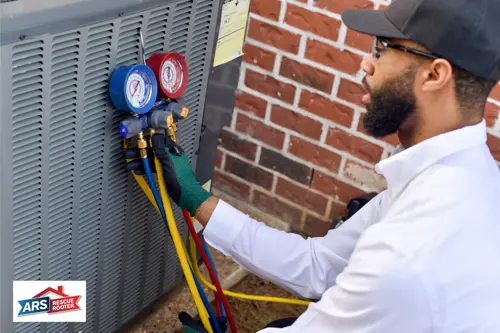 ARS Rescue Rooter professional attaching tools to an outdoor AC unit outside the home to repair it.